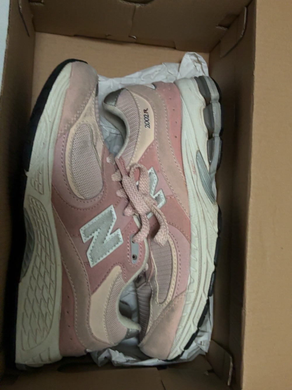 New Balance pink sneakers, in big kids 4.5 I wear a 7 in woman’s also fits good.